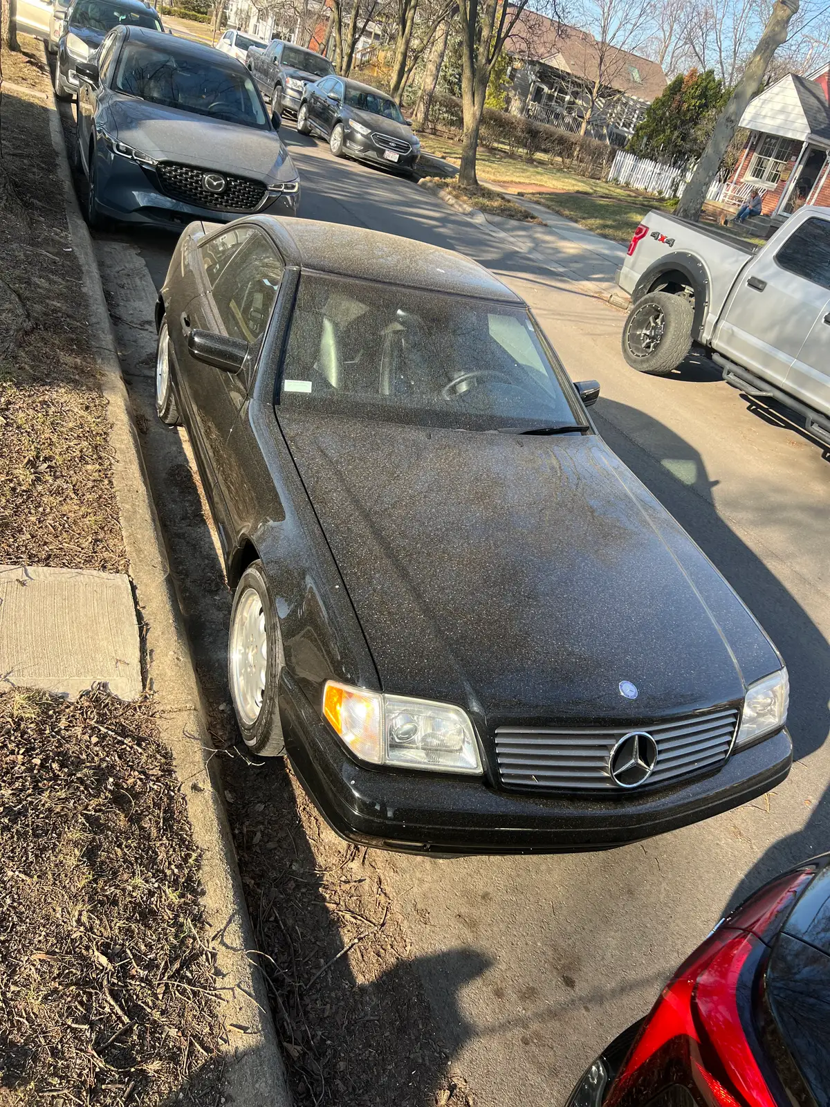 Dusty classic Mercedes, gleaming under the bright afternoon sun. Still Frame
