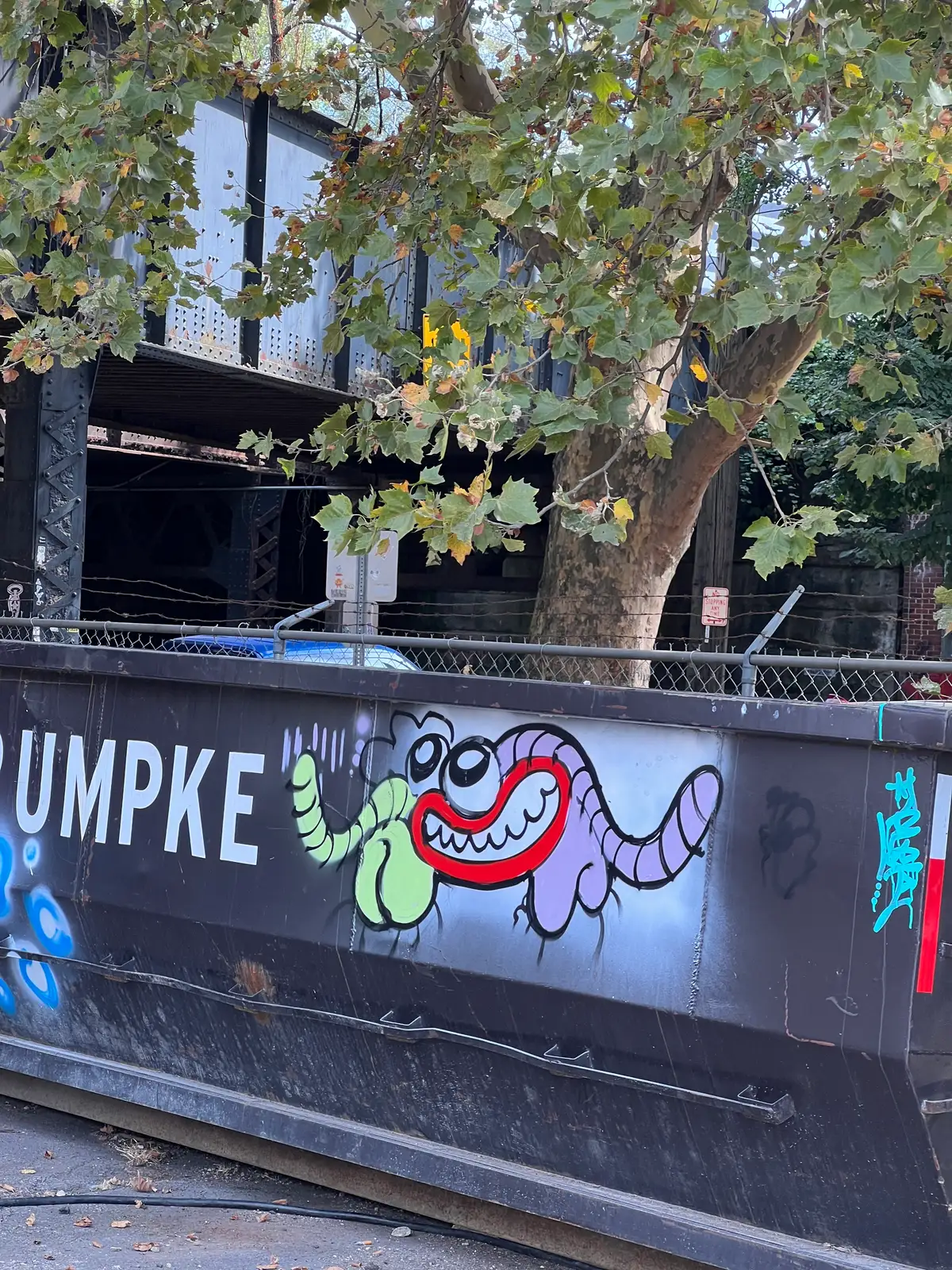 That's one way to brighten up a dumpster! Still Frame