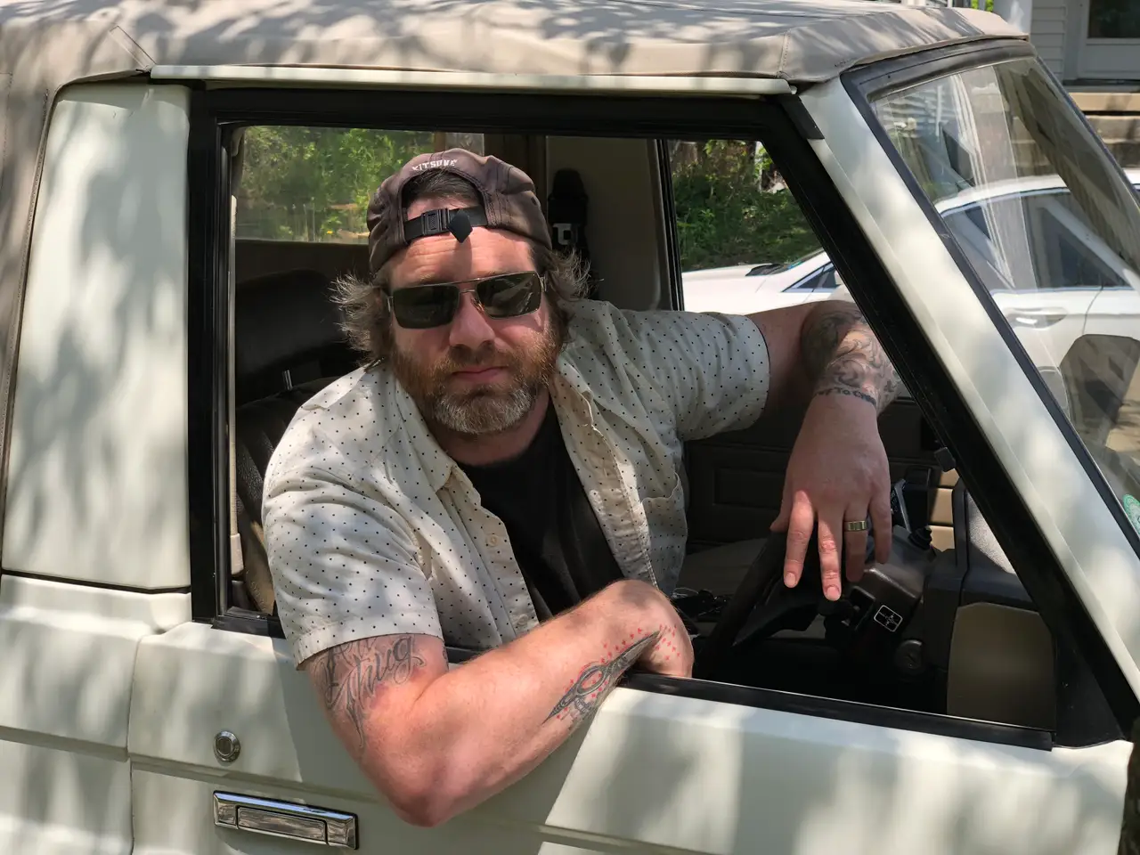 Shades on, top down, classic cool vibes. Still Frame