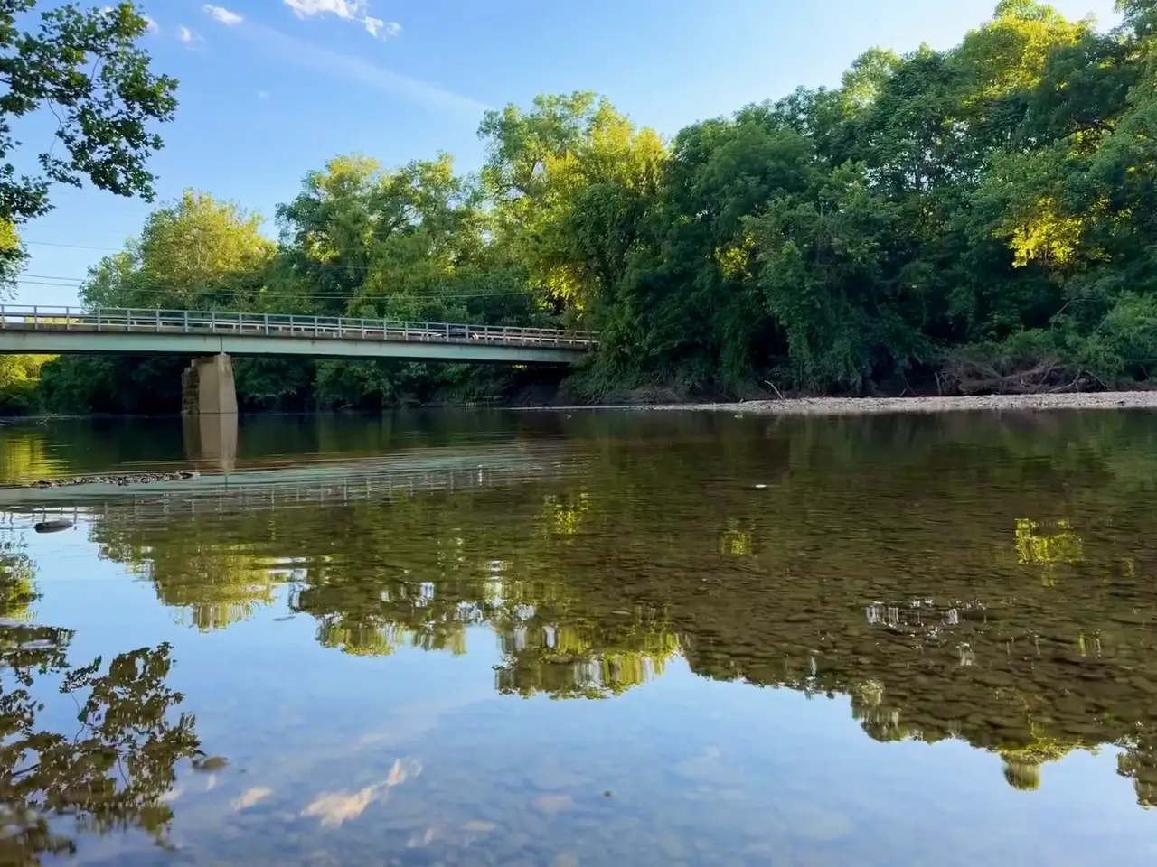 Serene waters mirroring a perfect summer day. Still Frame