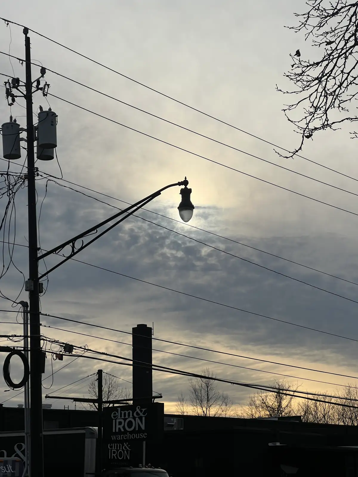 Urban glow, finding light amidst the dramatic clouds. Still Frame