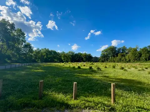 Pure blue skies and endless green fields stretch before us.