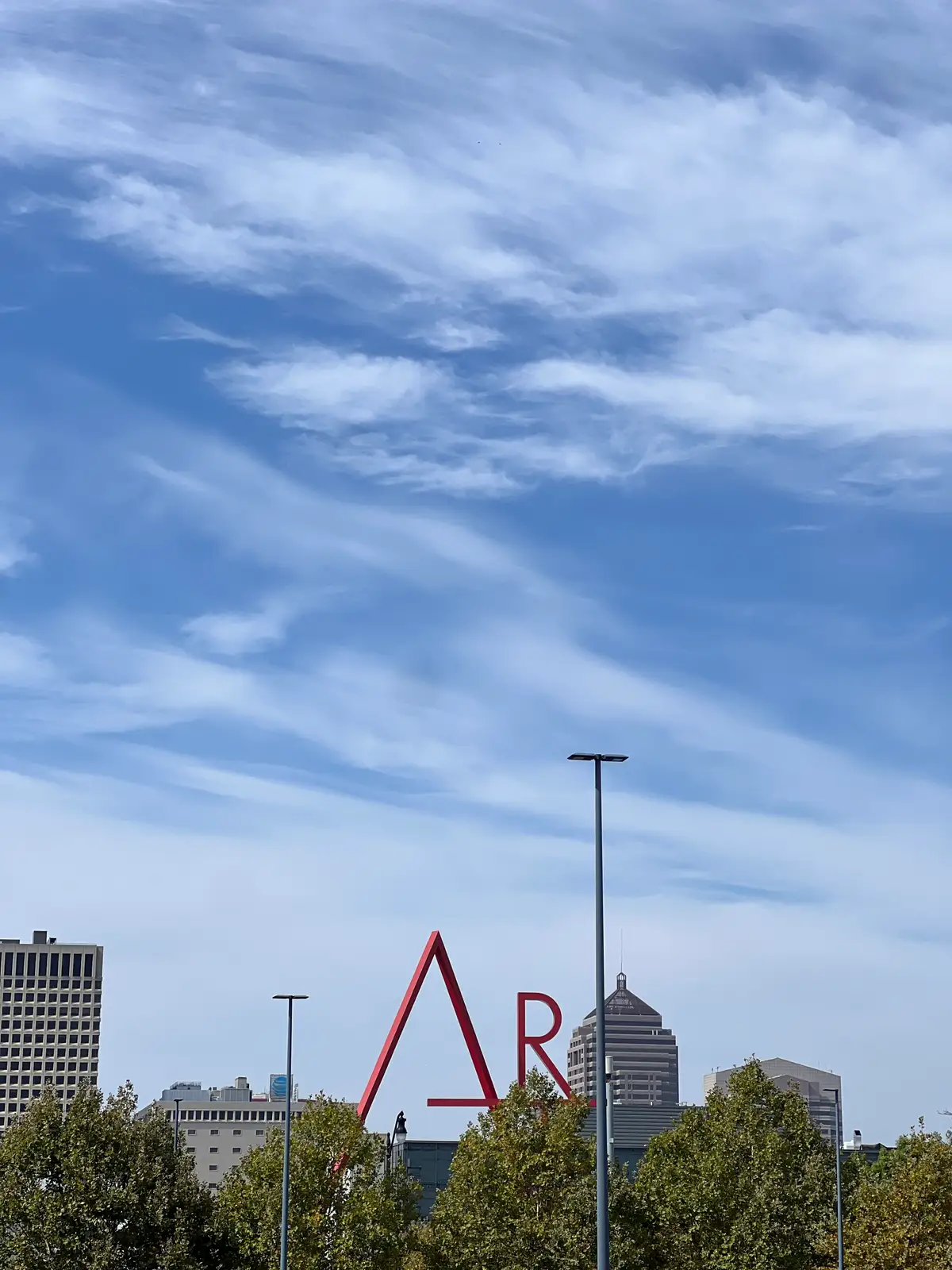 Big art, big sky, big city vibes. Still Frame