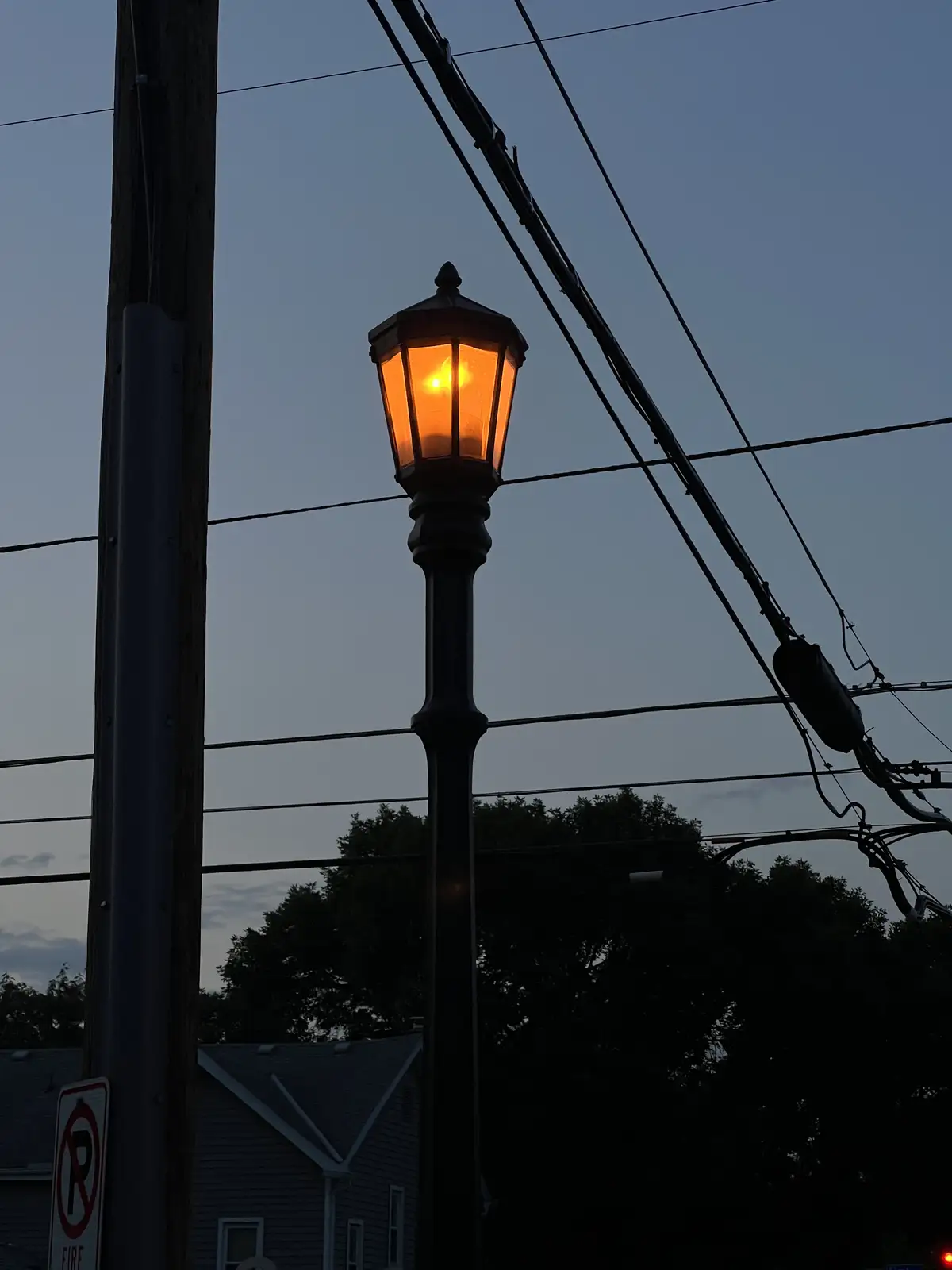 Golden light cuts through the twilight blue. Still Frame
