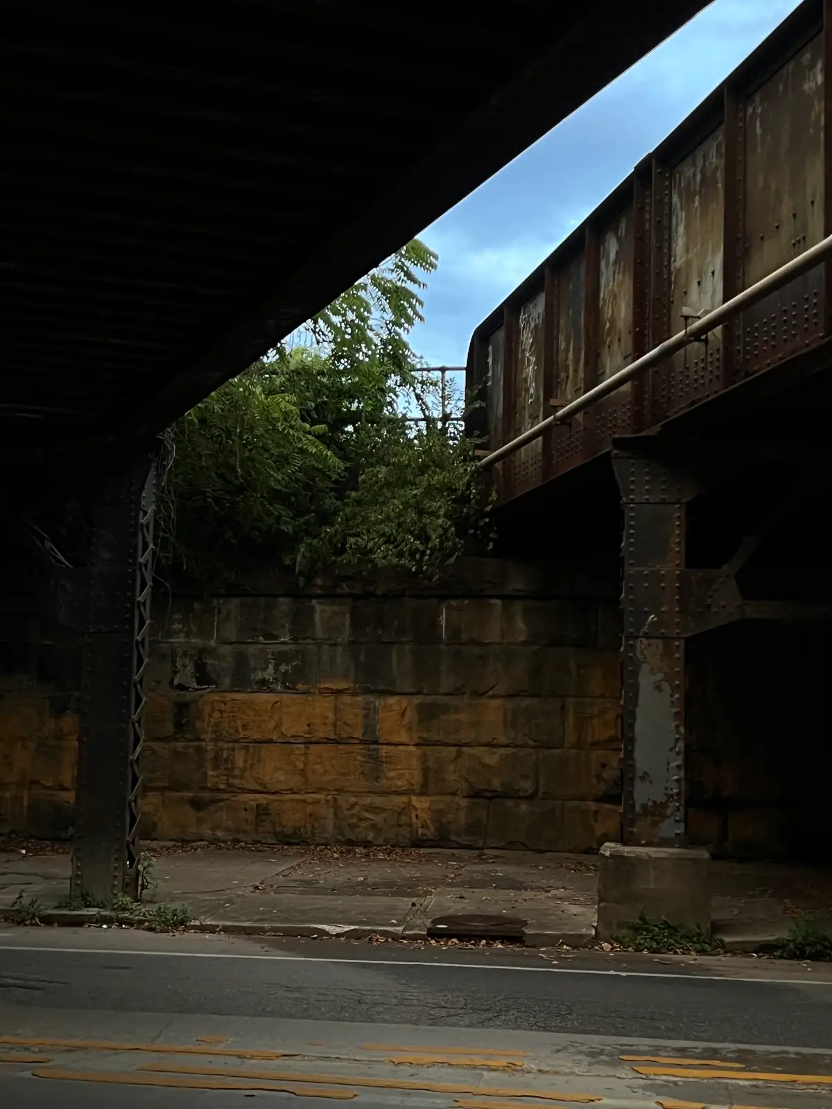 Gritty city vibes under the elevated railway. Still Frame