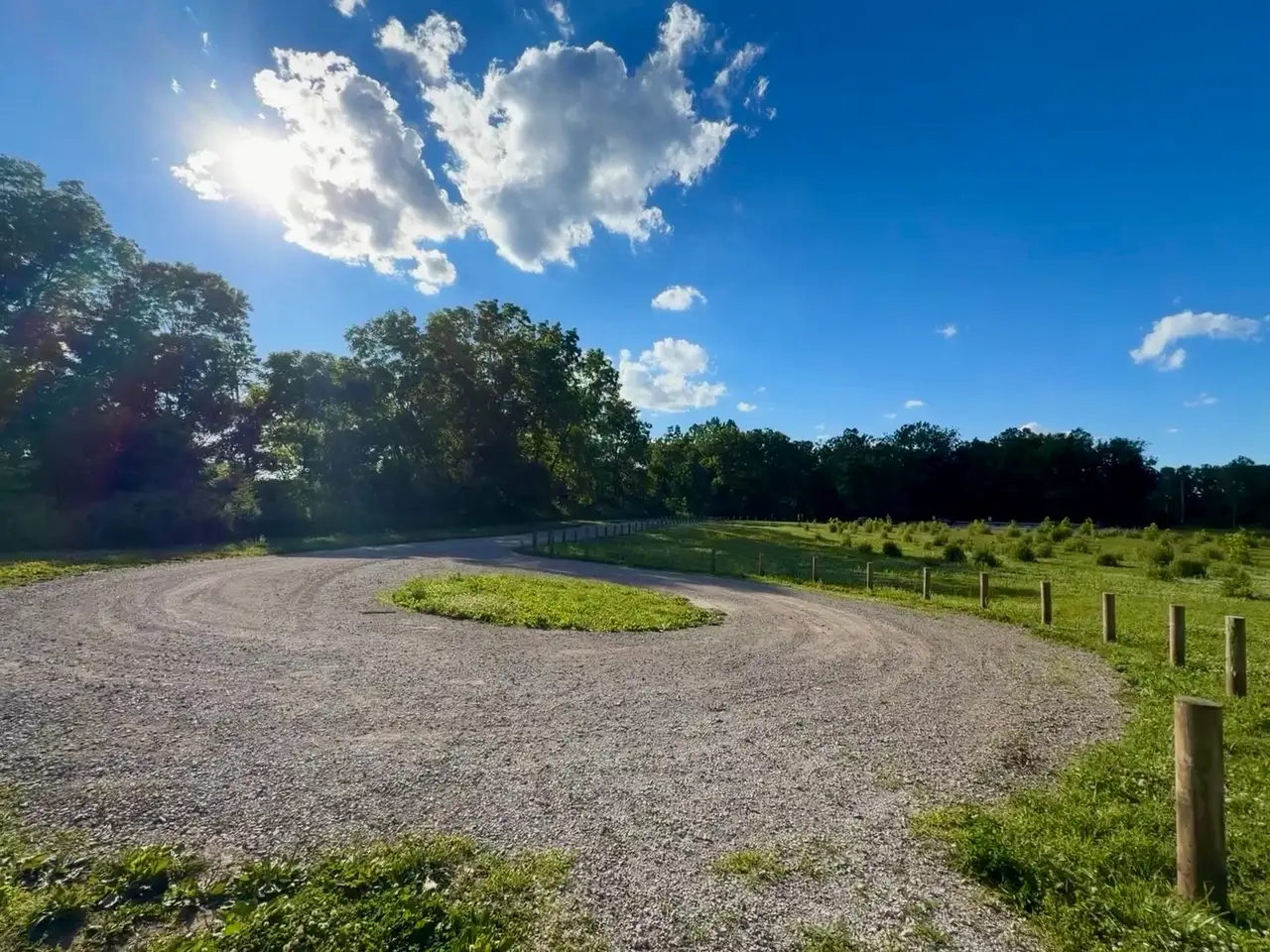 Sunny skies and winding paths invite exploration. Still Frame