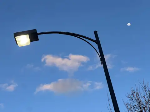 Streetlight, moon, and a perfect twilight sky.