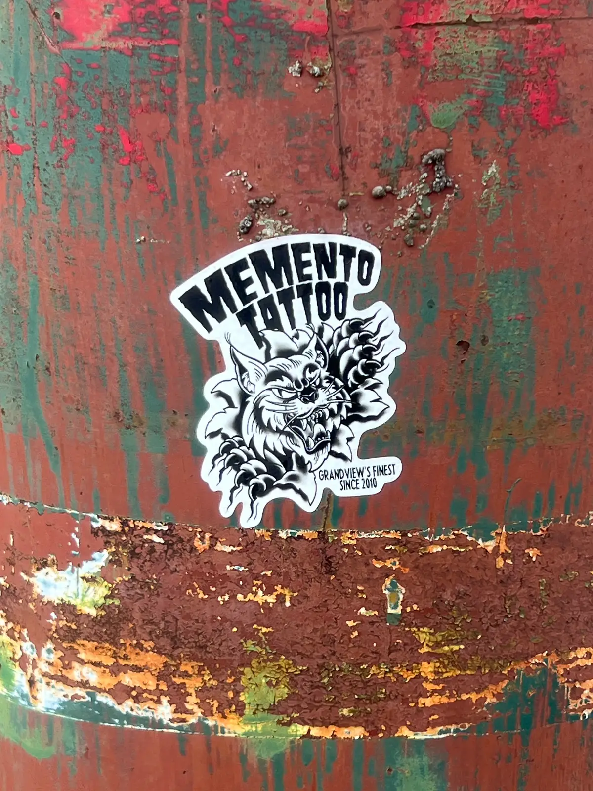 Gritty street art finds its canvas on vibrant, rusted metal. Still Frame