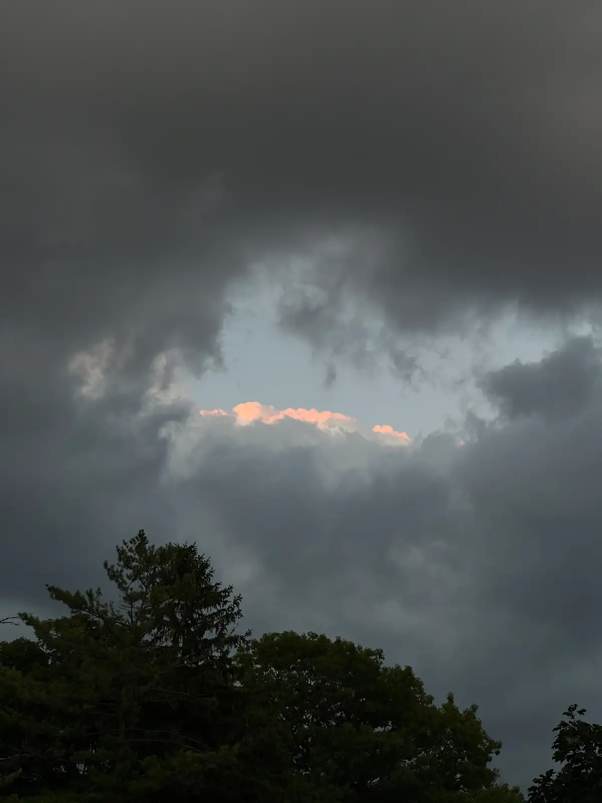 Glimmers of hope peeking through the dramatic storm clouds. Still Frame