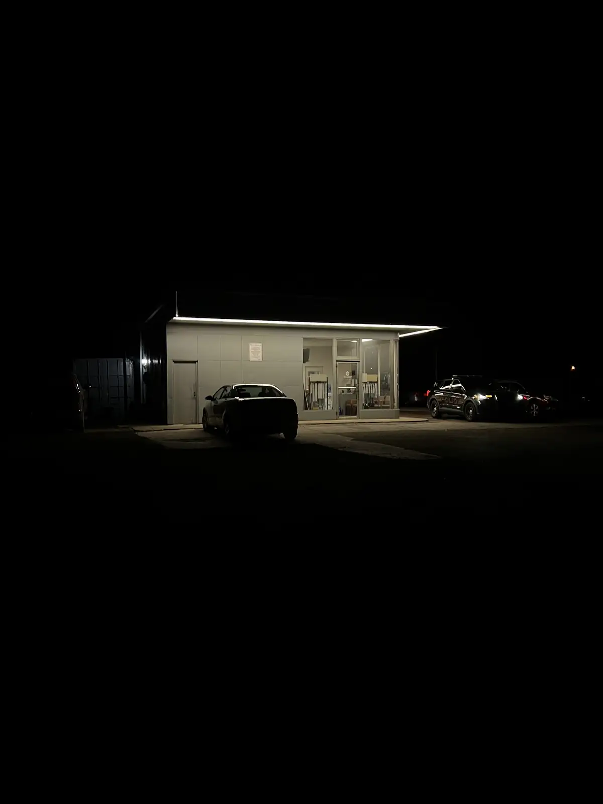 Night's glow illuminates a solitary stop. Still Frame