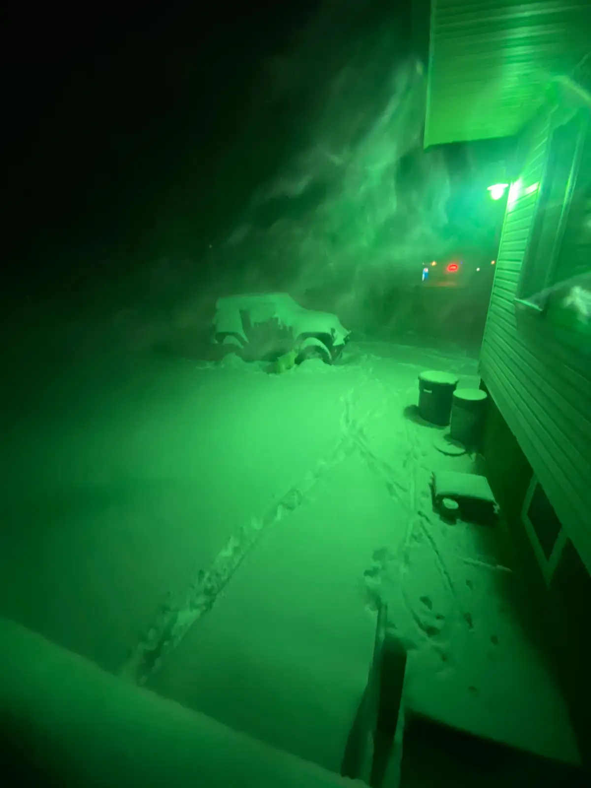 Eerie green light transforms this snowy winter night. Still Frame