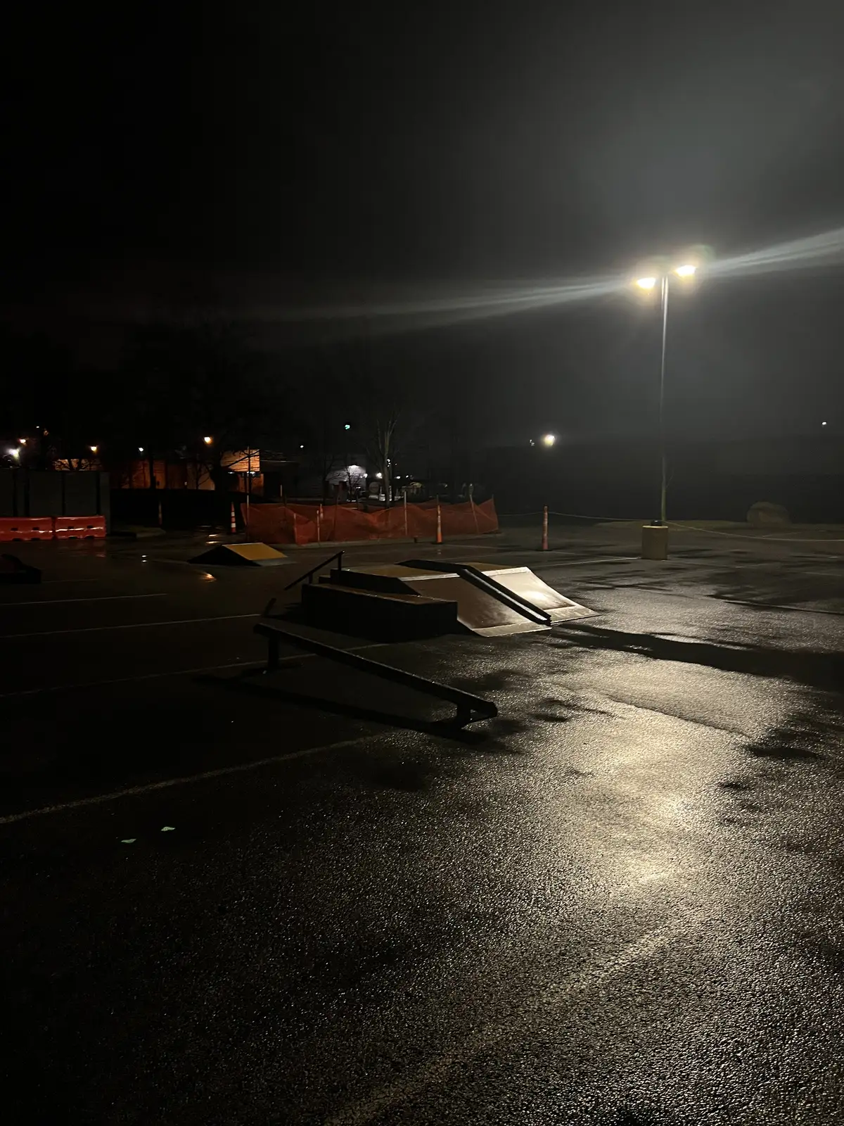 Night falls, leaving the skatepark wet and waiting. Still Frame