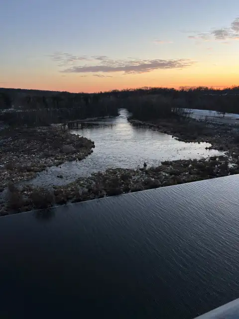 Winter's calm embrace under a fiery sky.