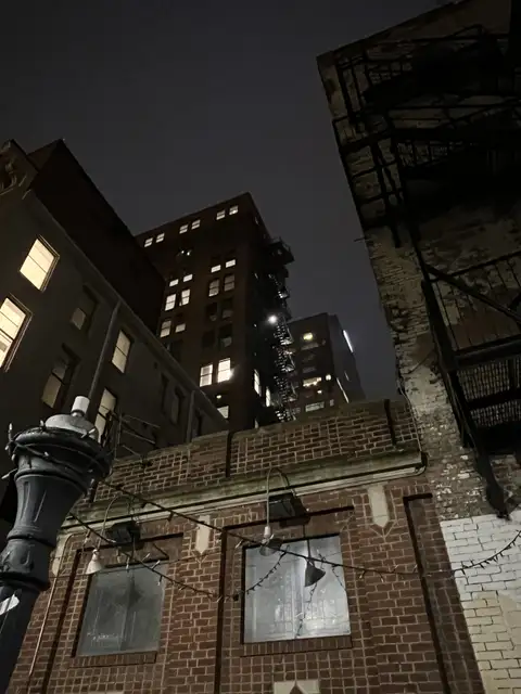 Urban grit meets night's soft glow.