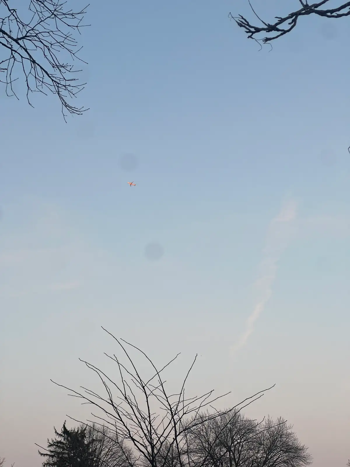 A small orange spark in the cool, wide open sky. Still Frame