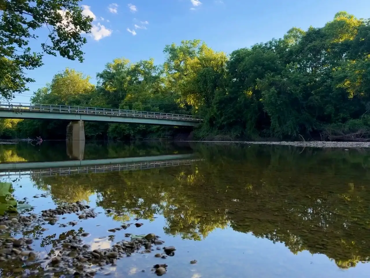 Reflections shimmer, capturing a perfectly serene day. Still Frame