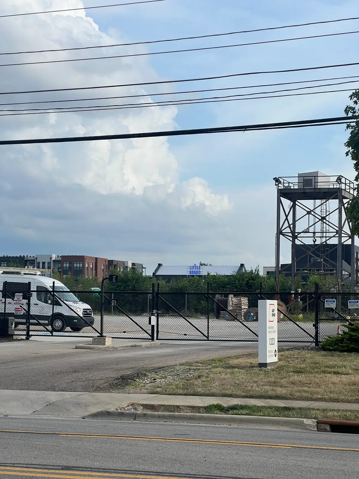 Where city meets industry under a vast sky. Still Frame