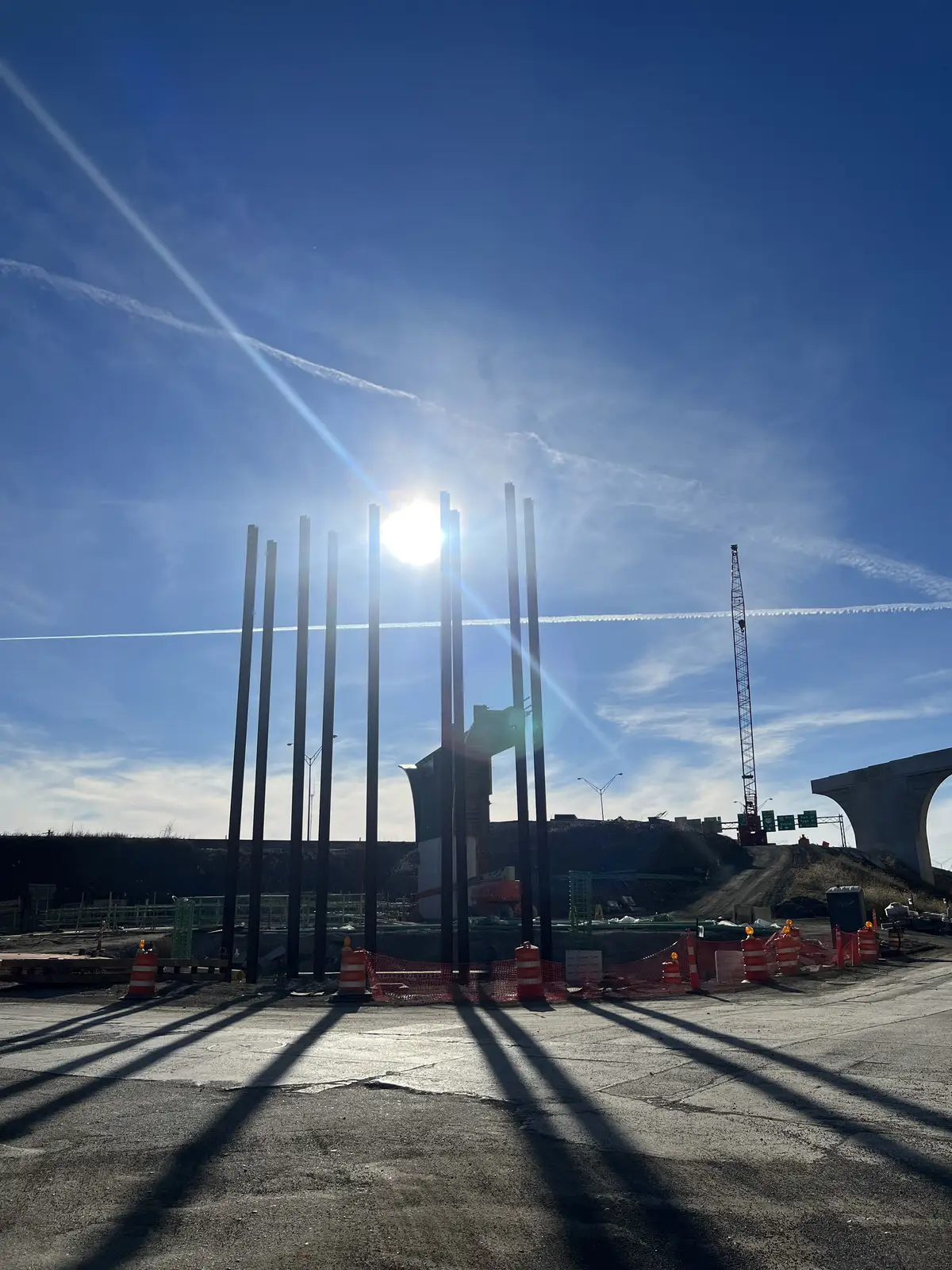 Bright sun, bold shadows, new structures taking shape. Still Frame